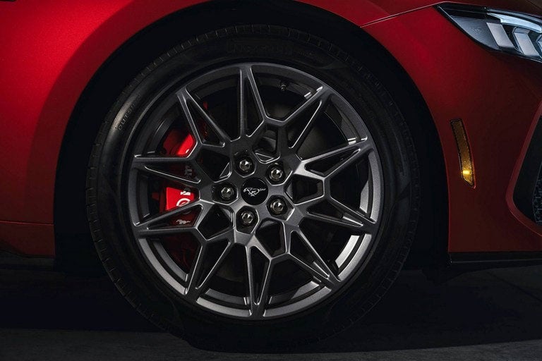 2024 Ford Mustang® model with a close-up of a wheel and brake caliper | Palm Coast Ford in Palm Coast FL
